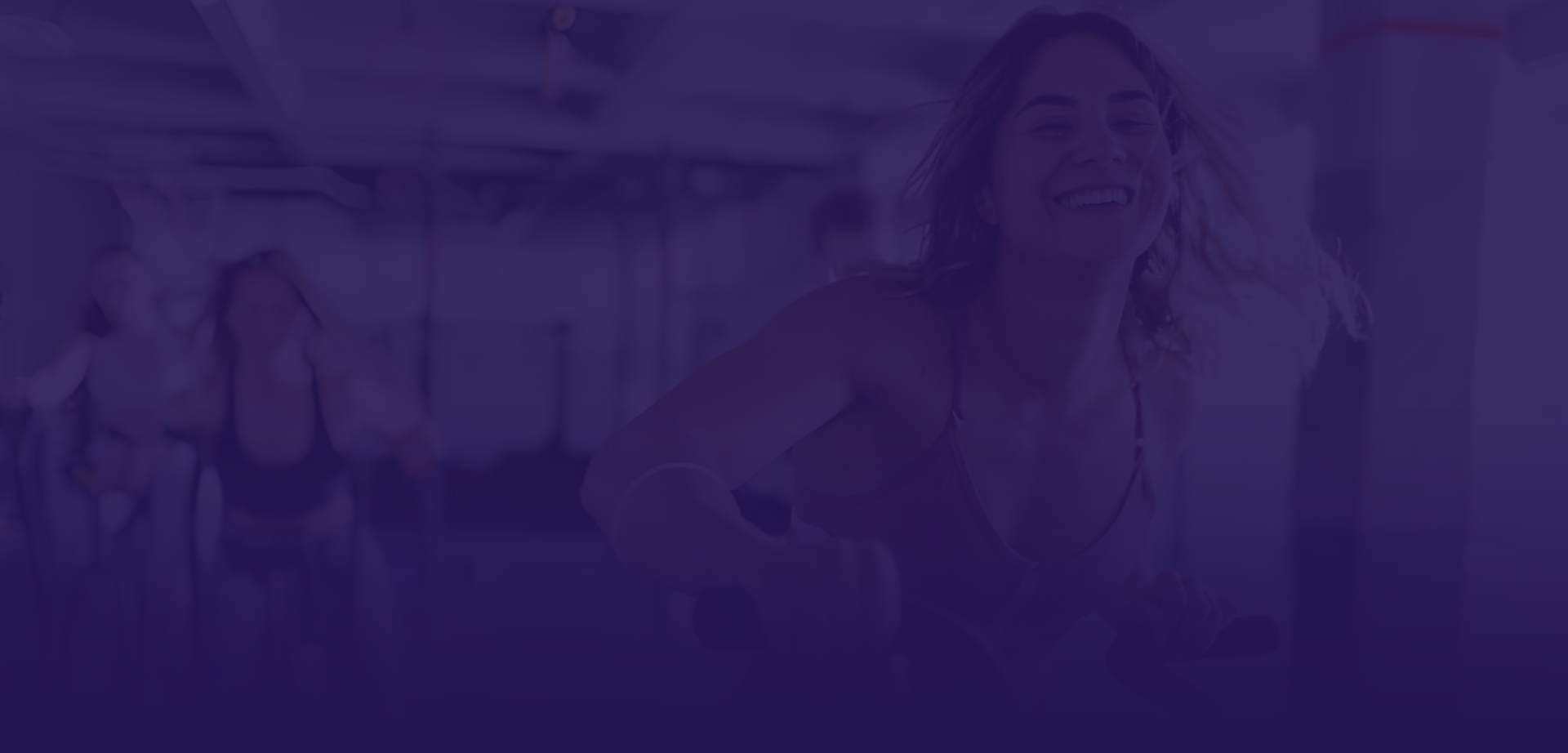 Blurred background of people working out in a gym