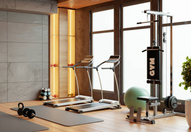 Modern gym interior with treadmills facing large windows with wooden frames, warm lighting