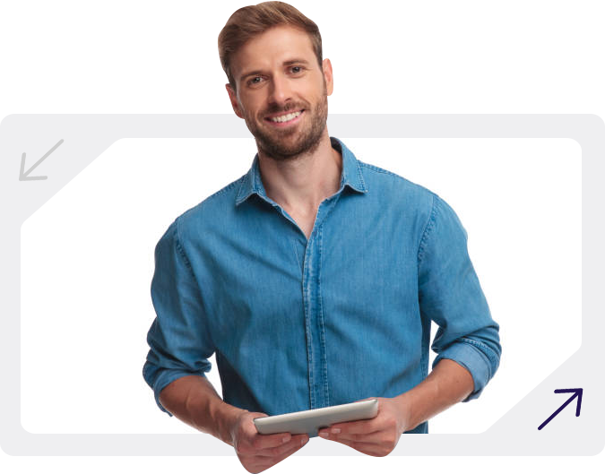 Man in blue denim shirt holding a tablet smiling