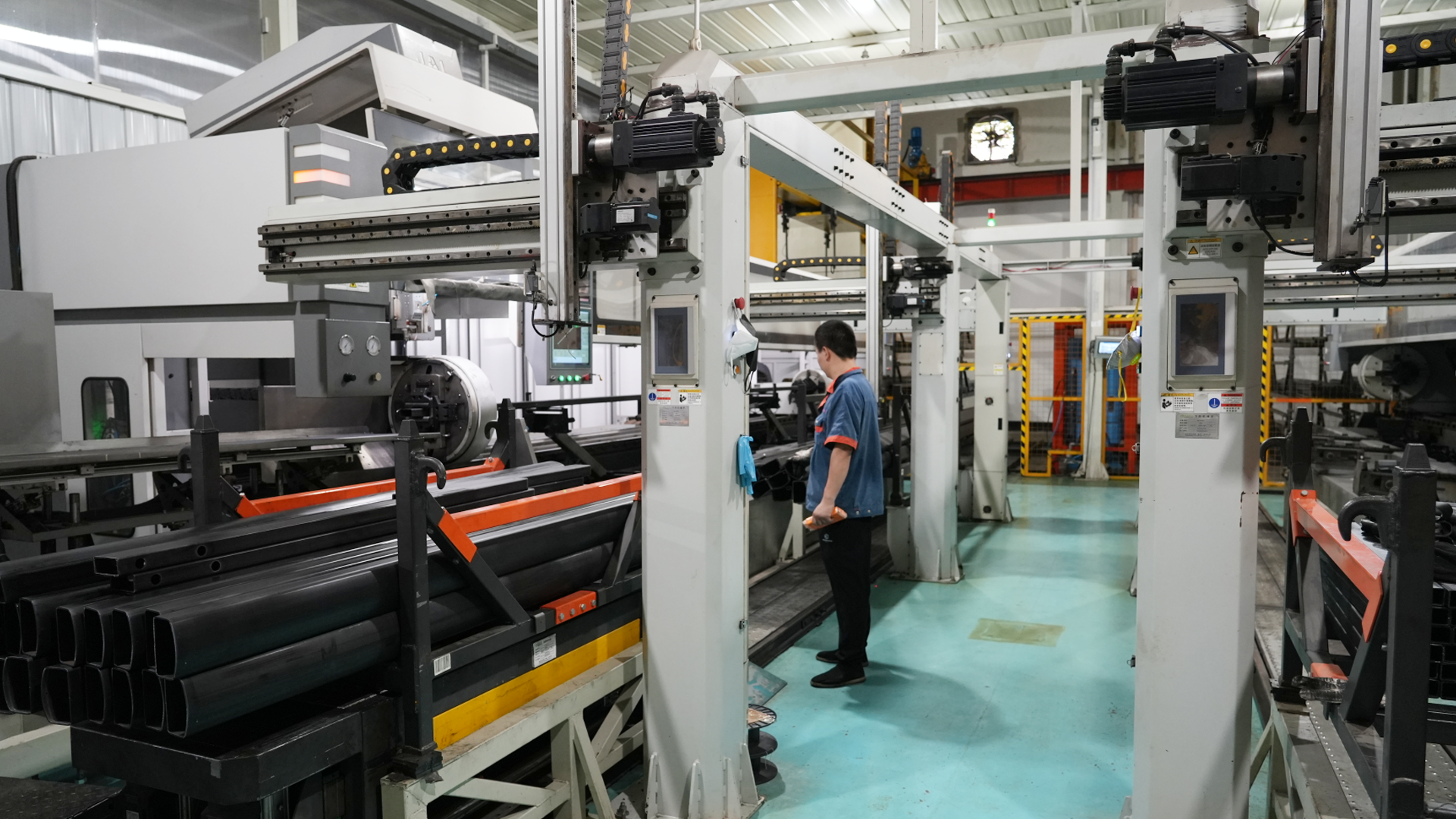 INPEK Manufacturing Facility showing heavy machinery and workers