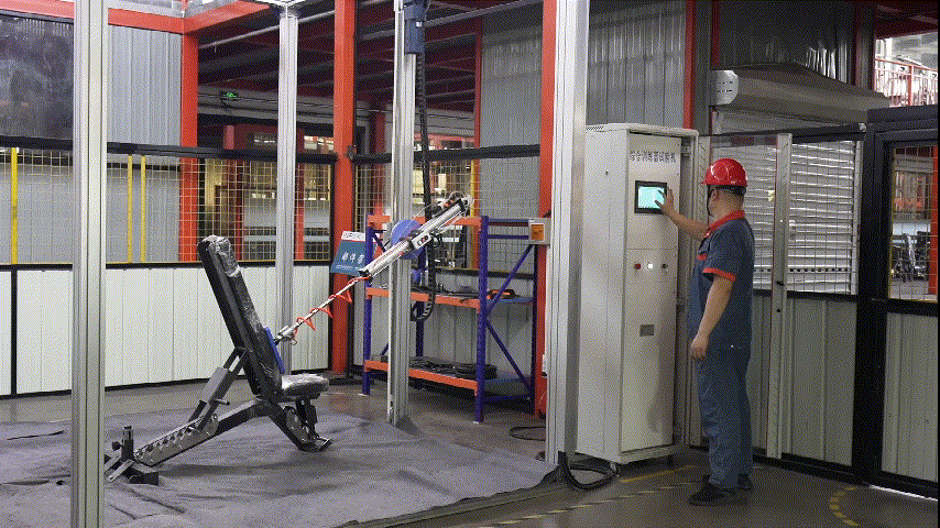 Testing machine applying force to a piece of gym equipment