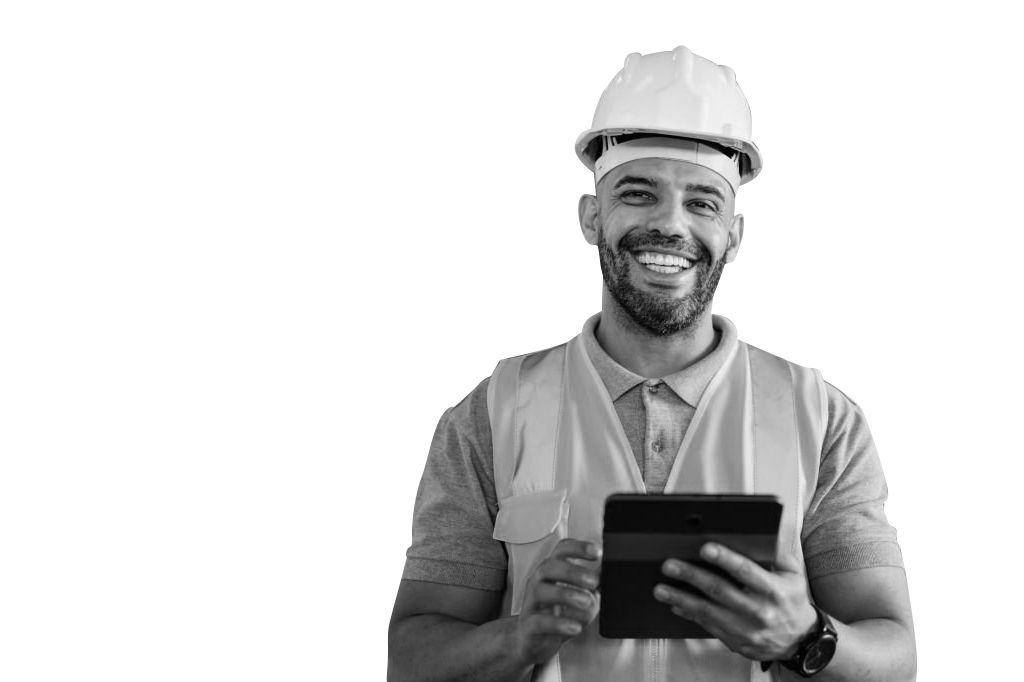 Black and white image of a smiling maintenance worker in a hard hat